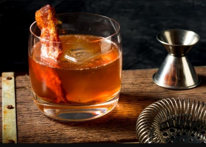 Cocktail of the Week – Sip this Boozy Maple Bacon Old-fashioned for World Bacon Day.