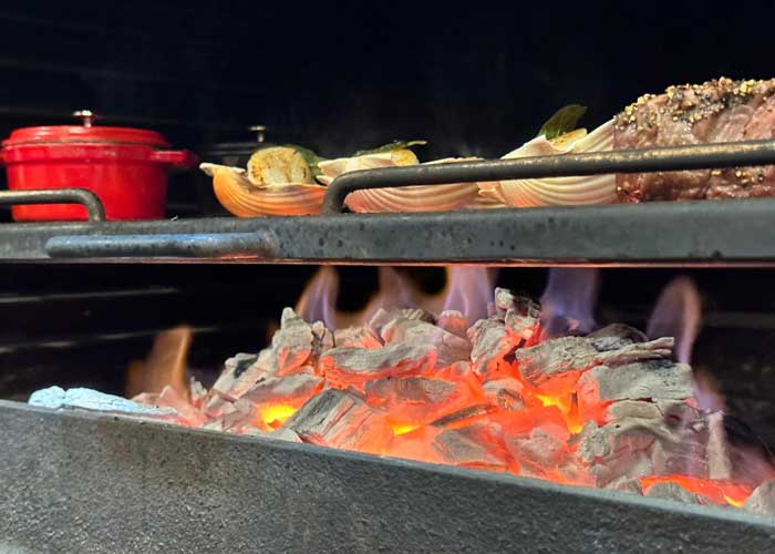 Tips for Cooking with Fire Like a Pro and Six Restaurants to Experience Smoky Goodness.