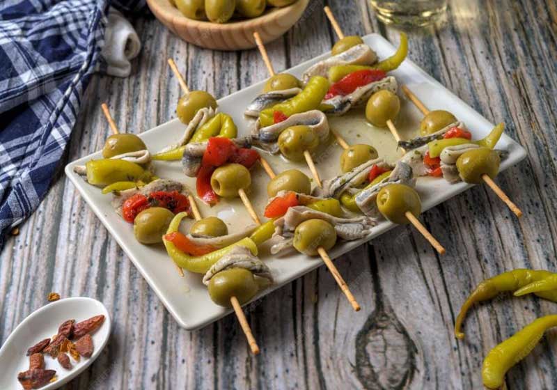 The Perfect Spritz Hour Snacks: Gilda Skewers, White Anchovies, Olives & Salumi