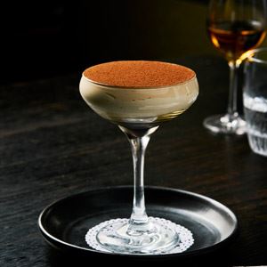 Italian dessert tiramisu in martini glasses at a pajamas party Photos