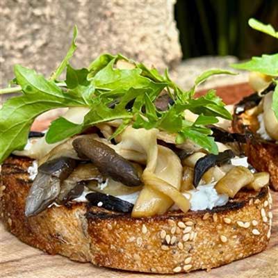 Sauteed Oyster Mushrooms, Goats’ Cheese, Black Garlic and Rocket on Grilled Sourdough - Chef Recipe by Matt Golinski.