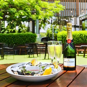 Savour $2 oysters, bubbles, and live music with stunning sunset views.