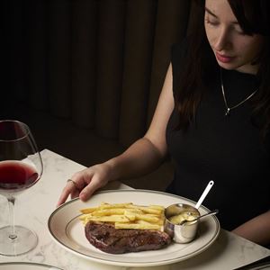 Tuesday Steak Frites at Le Foyer Brasserie with sommelier selection glass of wine – $48