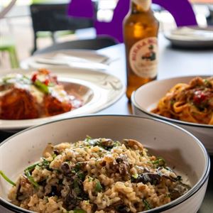 Wood-Fired Pizzas & Hearty Pastas Await